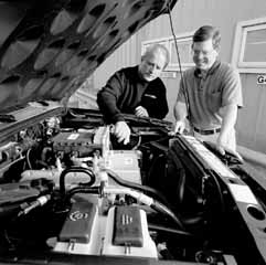 Shull and George Davison (left) check under the hood