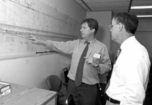 Chris Laughton(left) explains NuMI excavation to Dougal McCreath.