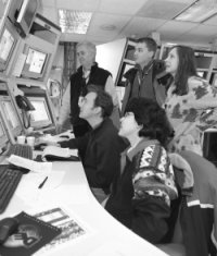 CDF experimenters on shift in the detector's control room