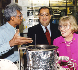On a visit to Argonne National Laboratory, Rep. Biggert(right) and Secretary of Energy Spencer Abraham (center) take a look at a hydrogen fuel cell with Argonne scientist Ray Sekar.