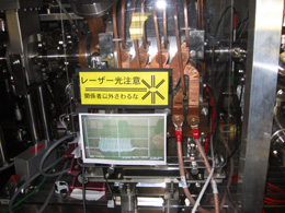 A warning in KEK's Accelerator Test Facility reads, 'Laser Light. Caution. Unauthorized users prohibited.'