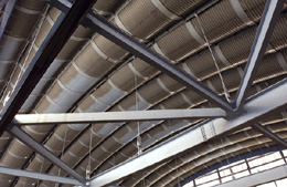 The roof of the Meson Building, which hosts the new Test Beam Facility, consists of half-sections of steel culverts. The structure is as famous for its architectural style as it is for leaks.