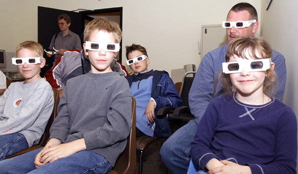3-D glasses allow a view of the Virtual Reality of the CDF detector.