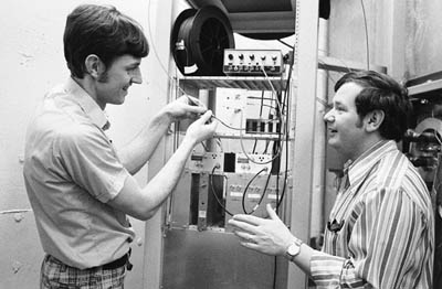 Ray Hren (right) and Jim Wendt, (left), shown here in 1979, drew ID numbers 80 and 81 when they were among the earliest hires at Fermilab in January, 1968.