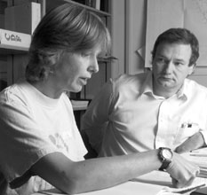 Computer Division Head Mathias Kaseman(right) confers with Physicist Vivian O'Dell
