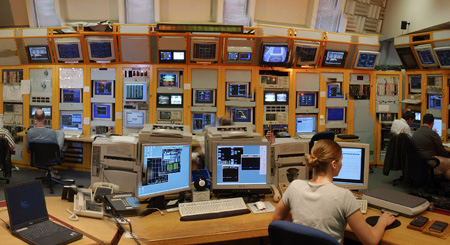 Operators in the Main Control Room work around the clock to run the collider